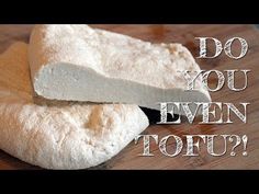 two pieces of bread sitting on top of a cutting board with the words do you even tofu?