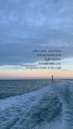 a person standing on top of a boat in the ocean with a quote above it