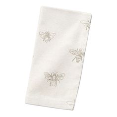 a white towel with bees on it