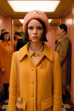 a mannequin wearing a yellow coat and pink hat in a hallway with other people