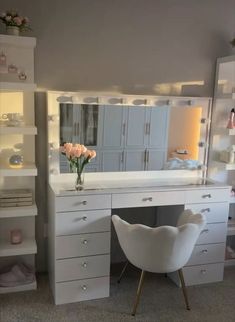 a white chair sitting in front of a vanity