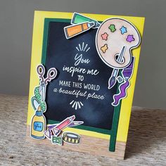 a handmade greeting card with an image of a chalkboard and crafting supplies