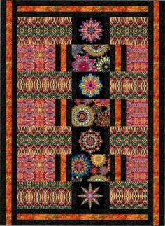 a colorful quilt with many different designs on the front and back, along with an orange border