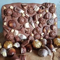 there is a chocolate tray with many different types of candies on it