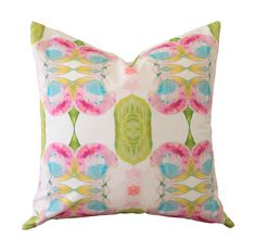 a pink and green pillow with flowers on it