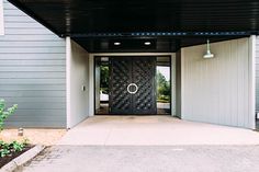 the entrance to a building with a black door