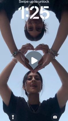 two women making a heart shape with their hands in front of the camera and text saying swipe up to unlock