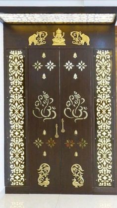 an ornate wooden door with gold designs on it