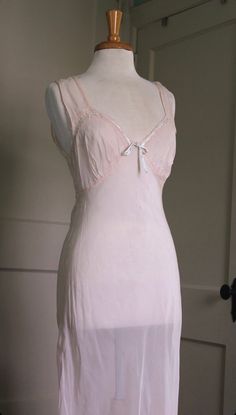 "1940's sheer bias cut slip dress Beautiful sheer ballet pink rayon/nylon (no material tag). Contrasting baby blue bow along the top of the bustline. Ties in the back. Dreamy! In good shape - some small holes throughout, including one in the front. Can be mended with a few stitches. Factored into price. Best fits xs-m depending on your desired fit. Bias cut dresses are meant to melt right onto the body and can fit a variety of sizes.  Bust: 32\" - 36\" Waist: 30\"-34\" Hips: 46\" taut Length: 57 Princess Letters, Bias Dress, Cut Dresses, Transparent Dress, Bias Cut Dress, Ballet Pink, 1930s Fashion, Blue Bow, Dress Beautiful