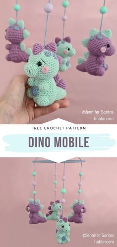 the crocheted mobile is being held by someone's hand and has three small stuffed animals hanging from it