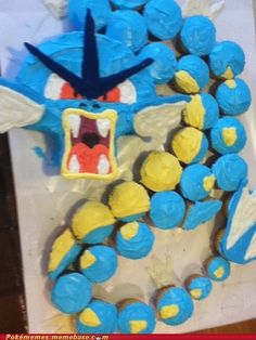 a blue and yellow cake with an angry face on it