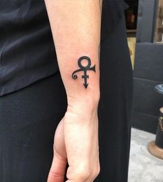 a person with a small tattoo on their arm