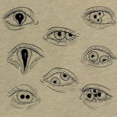 several different types of eyes drawn on paper