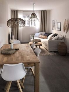 a living room filled with furniture and a wooden table