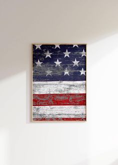 an american flag painted on the side of a wall in a room with white walls