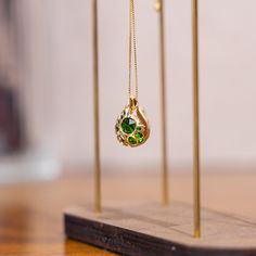 Find More Treasures➡️https://animepixelprint.etsy.com Embark on a magical adventure with this handcrafted Zelda Vessel Necklace, featuring emerald green stones set in 18k gold. Perfect for fans of the legendary game, this necklace is a unique piece of fine jewelry that blends elegance with a touch of gaming nostalgia. Available in two sizes, it's a special gift for any gaming enthusiast. 💚 Handcrafted with precision using 18k gold and vibrant emerald green stones Inspired by the iconic Zelda universe, a perfect blend of adventure and fine jewelry Two size options: 📏Standard 0.59 Inches (15mm) and Mini 0.39 Inches (10mm)📏 for versatile wear Ideal as a gamer gift or for fans of magical and mystical jewelry High-quality craftsmanship, suitable for daily wear or special occasions Custom ord Loz Jewelry, Gold Spiritual Emerald Necklace, Zelda Botw Jewelry, Link Earrings Zelda, Legend Of Zelda Necklace, Emerald Green Stone, Mystical Jewelry, Stone Accessories, Gamer Gifts