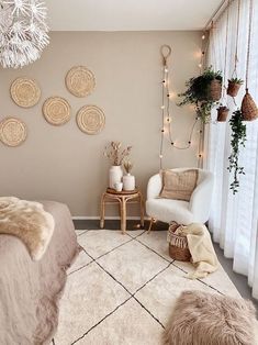 a bedroom decorated in neutrals and whites with wicker baskets hanging on the wall