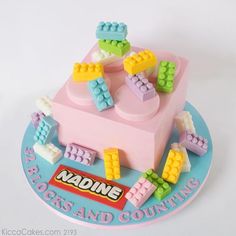 a birthday cake with legos and counting on it