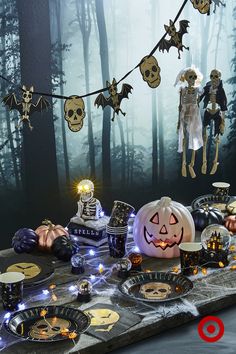 a table topped with lots of halloween decorations