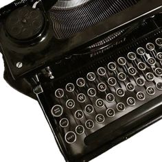 an old fashioned black typewriter on a white background