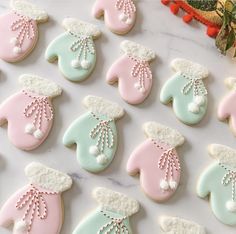 decorated cookies are displayed on a table