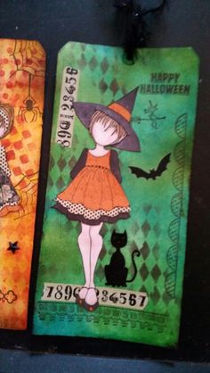 two tags decorated with halloween images on them