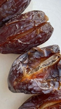 three dried dates sitting on top of a table