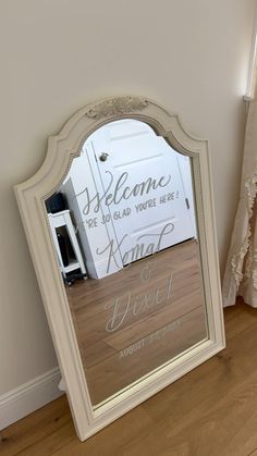 a mirror sitting on top of a wooden floor