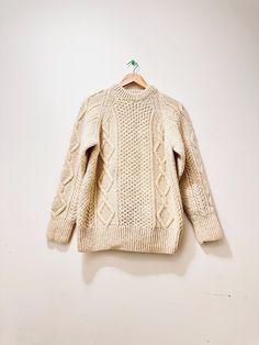 Vintage Irish wool sweater. chunky knit, Creamy white thick wool fishermen, Irish sweater that is perfect for cozy nights in front of an out door log fire pit. Material: 100% Irish wool Condition: In fair vintage condition with piling and minor signs of use, gently loved. Measurements: Shoulder to shoulder: 18" Bust:  19" Length: 27" Sleeve length: 22" Estimated size: Small to Medium Remember shipping is FREE to US IMPORTANT  Pay close attention to measurements and pictures. Measurements are mad Irish Wool Sweater, Irish Wool Sweaters, Log Fire, Irish Sweater, Sweater Chunky, Thick Wool, Chunky Knit Sweater, Sweater Vintage, White Sweater