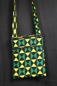 Check out this Green Ankara man bag. Its small, fun and funky. The perfect replacement for you wallet or purse for that quick trip to the shop. Don't judge a bag by its size, there is loads of space in this bag, with 3 outer pockets and 2 inner pockets. We are a brand with a purpose! All our bags are handmade in Africa, by Africans, with the aim of providing full time and sustainable employment to local craftspeople.  Read our full story on www.conitnentclothing.com Man Bag features - Large Volu Green Rectangular Pouch For On-the-go, Green Square Shoulder Bag With Cell Phone Pocket, Portable Yellow Phone Bag For Everyday Use, Green Rectangular Phone Bag For Daily Use, Yellow Pouch Phone Bag For Everyday Use, Green Zipper Travel Pouch, Green Rectangular Travel Pouch, Yellow Rectangular Shoulder Bag, Green Rectangular Shoulder Bag With Cell Phone Pocket