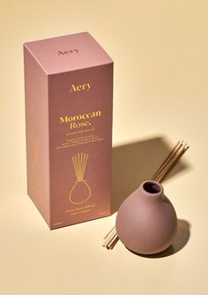 Aery Living dusty pink clay diffuser with reeds next to product packaging on a yellow background Rustic Chic Design, Moroccan Rose, Rose Gardens, Miniature Vase, Scent Diffuser, Rose Fragrance, Freshly Picked, Pink Clay, Soft Rose