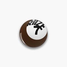 a brown and white button with the word nike in black on it's side