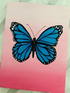 a painting of a blue butterfly on a pink background