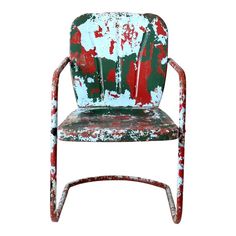 an old chair with paint splattered all over it's back and arms