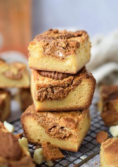 several pieces of cake sitting on top of a cooling rack