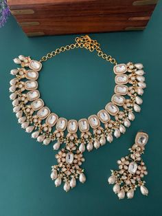 Uncut kundan necklace with earring . Amrapali style . Earring is about 2.5 inch long. Push back , gold plated . Indian Choker Necklace, Polki Necklace, Island City, Kundan Necklace, Kundan Earrings, Long Island City, Kundan Necklaces, Head Accessories, Stunning Earrings