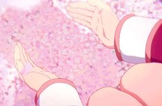 an anime character holding his hands out in front of pink and white speckles