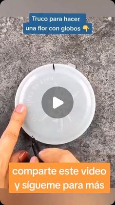 a person holding a white frisbee on top of a cement ground with words above it