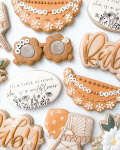 decorated cookies are displayed on a white surface