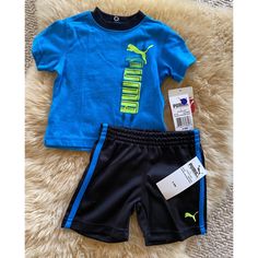 Nwt Puma Brand Baby Tee Shirt And Shorts Set. 3-6 Months. Blue Logo Tee Shirt With Black Shorts That Have Matching Blue Stripes Up Side. 3 Snaps Up Back Of Tee Shirt, Stretch Waist And On Shorts. Shirt Is Cotton/Polyester Blend And Shorts And Polyester. Cute Puma Shorts, Reborn Clothes, Baby Tee Shirt, Blue Tracksuit, Puma Outfit, Baby Tee Shirts, Sweats Outfit, Pink Sweat, Shirt And Shorts Set