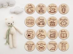 wooden badges with different types of things on them next to a teddy bear and cloud