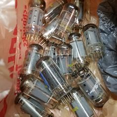 many different types of light bulbs in plastic bags