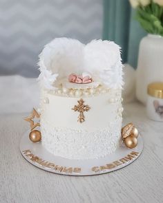 a white cake with gold decorations on top