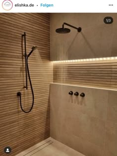 a bathroom with a shower head and hand held shower faucet in the corner