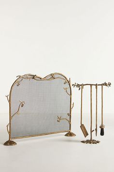 there is a metal bed frame with tools on the top and bottom, as well as an iron headboard