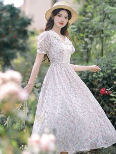 Embrace the vintage cottagecore aesthetic with this enchanting floral fairy dress! Its delicate design and nostalgic feel will transport you to a whimsical land of adventure and daring. Decorated with a floral print, intricate details, puff sleeves and delicate lace trims. Size: S Bust: 80cm Waist: 66cm Length: 111cm Size: M Bust: 84cm Waist: 70cm Length: 112cm Size L Bust: 88cm Waist: 74cm Length: 113cm Size XL Bust: 92cm Waist: 78cm Length: 114cm Fairycore Vintage Dress With Ruffles For Garden Party, Feminine Vintage Dress For Garden Party, Fairycore Short Sleeve Dress For Garden Party, Spring Fairycore Floral Print Dresses, White Fairycore Dresses With Floral Print, White Floral Print Fairycore Dress, Summer Fairycore Vintage Dress, Cottagecore Dresses With Lace Trim, Summer Cottagecore Prairie Dress