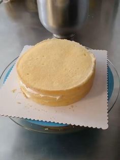 a pink heart shaped cake sitting on top of a plate