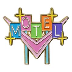 a pin with the word motel on it in multi - colored letters and an arrow