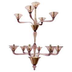 a chandelier with six lights hanging from it's sides and four arms