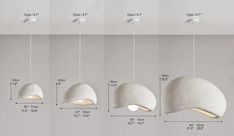 three white lamps hanging from the ceiling with measurements for each bulb and one light fixture